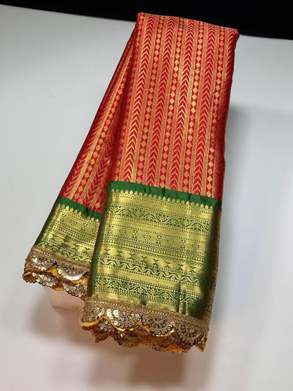 Red with green kanchivaram semi pattu saree with intricate aari lace border