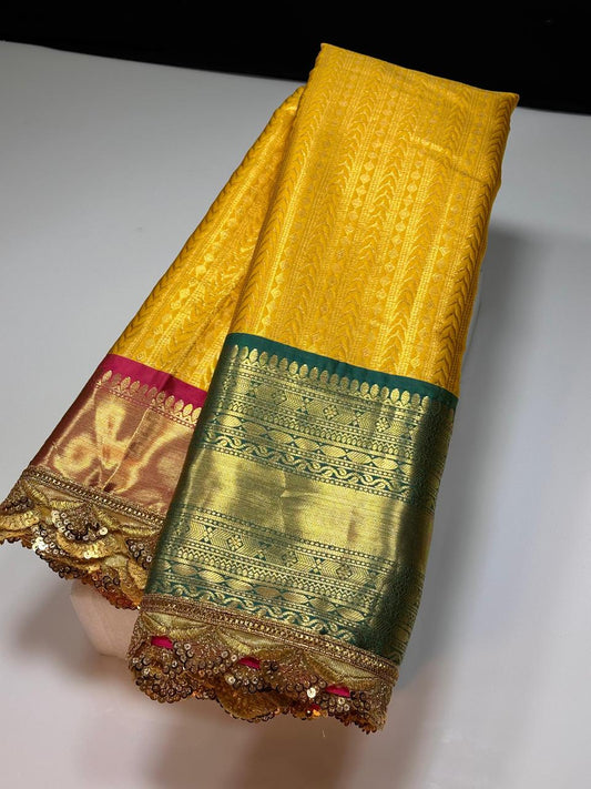 Yellow with green semi kanjivaram silk saree with aari border